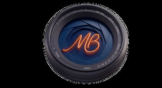 Camera lens with blue interior and orange neon MB lettering on black background